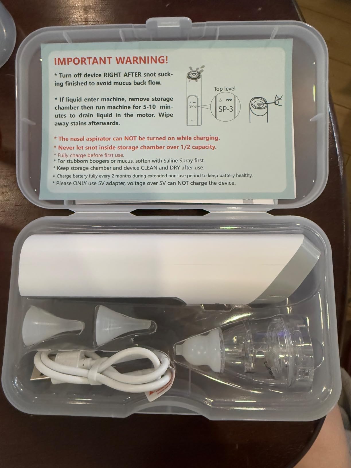 Grownsy electric nasal aspirator device on a tabletop