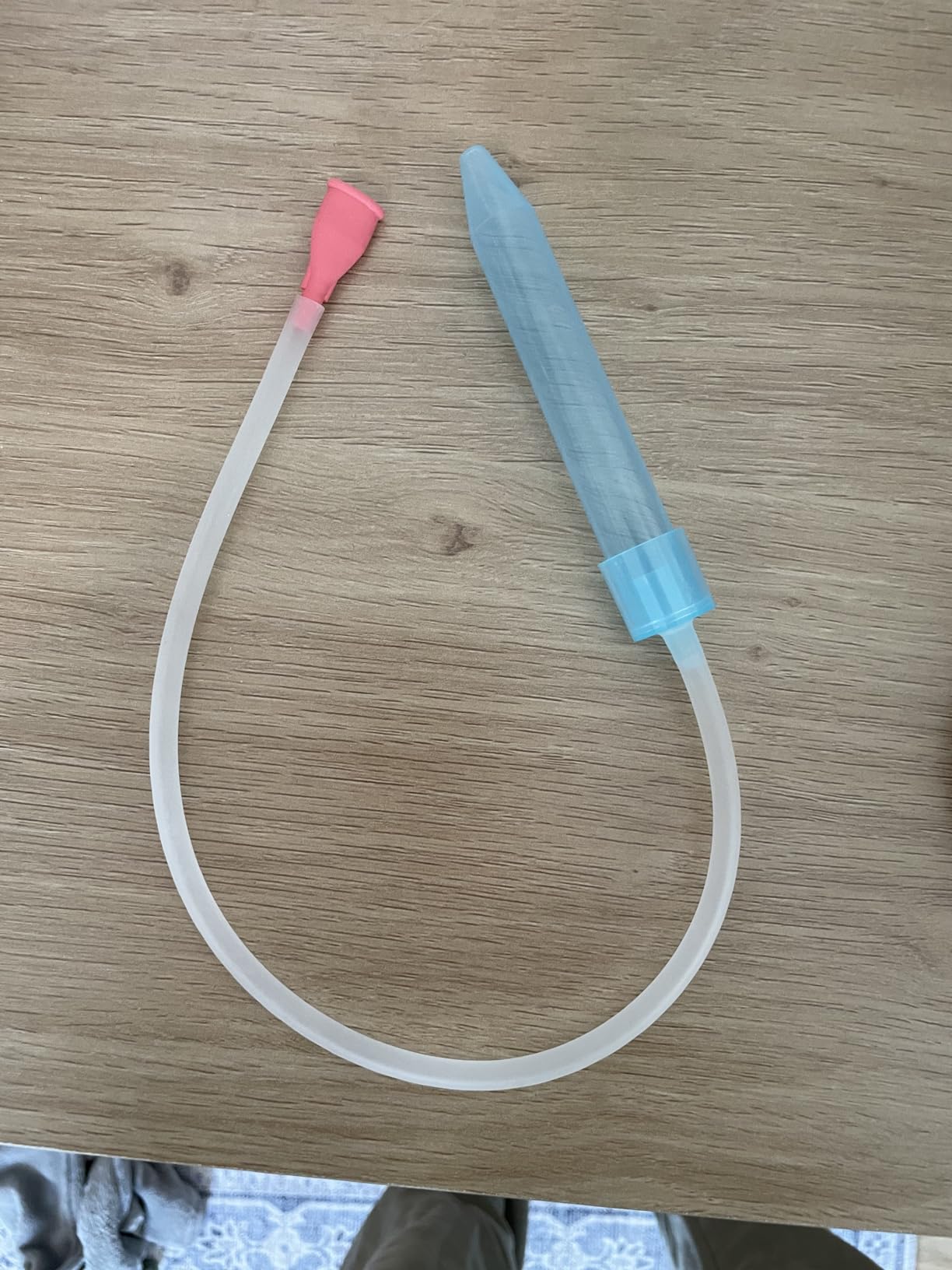 NoseFrida tube and nasal tip laid out after disassembly
